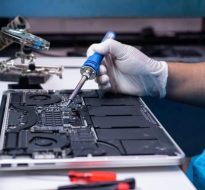 engineer-repairs-laptop-motherboard